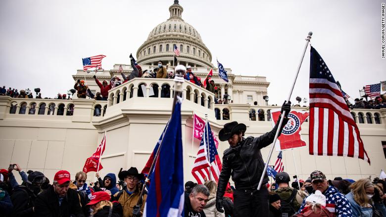 WASHINGTON, DC - JANUARY 06: Pro-Trump supporters storm the U.S. Capitol following a rally with President Donald Trump on January 6, 2021 in Washington, DC. Trump supporters gathered in the nation's capital today to protest the ratification of President-elect Joe Biden's Electoral College victory over President Trump in the 2020 election. (Photo by Samuel Corum/Getty Images)