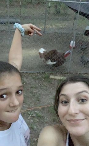 Alexa and her sister Shelby taking care of the chickens. 