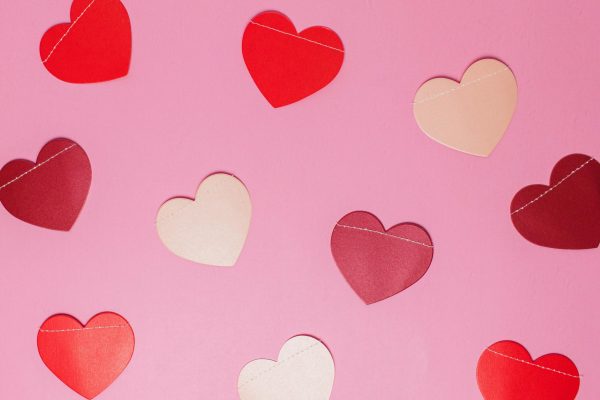 Heart cutouts on pink background