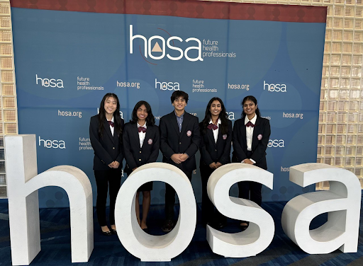 Mountain Ridge Students in front of HOSA sign