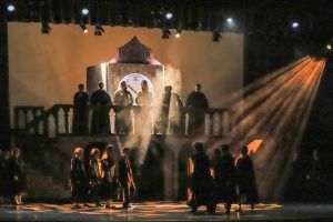 scene from Harry Potter play, with people on the set's balcony