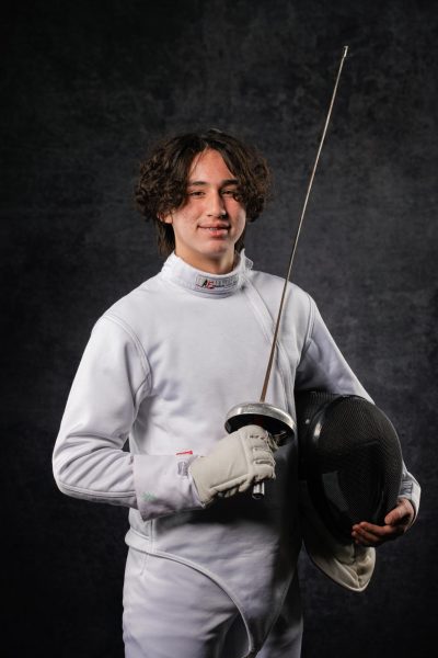 Luke poses in fencing gear