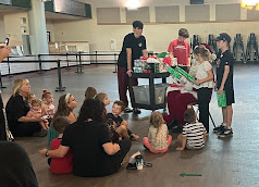 StuGo members give out gifts to kids