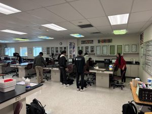 students clean lab station