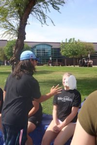 student is hit in the face by a pie
