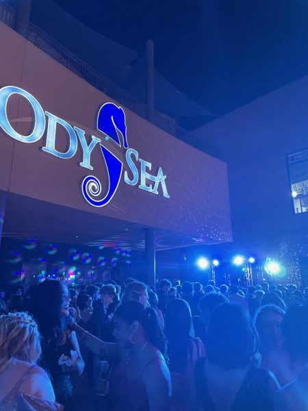 Dancefloor underneath Odysea Aquarium sign