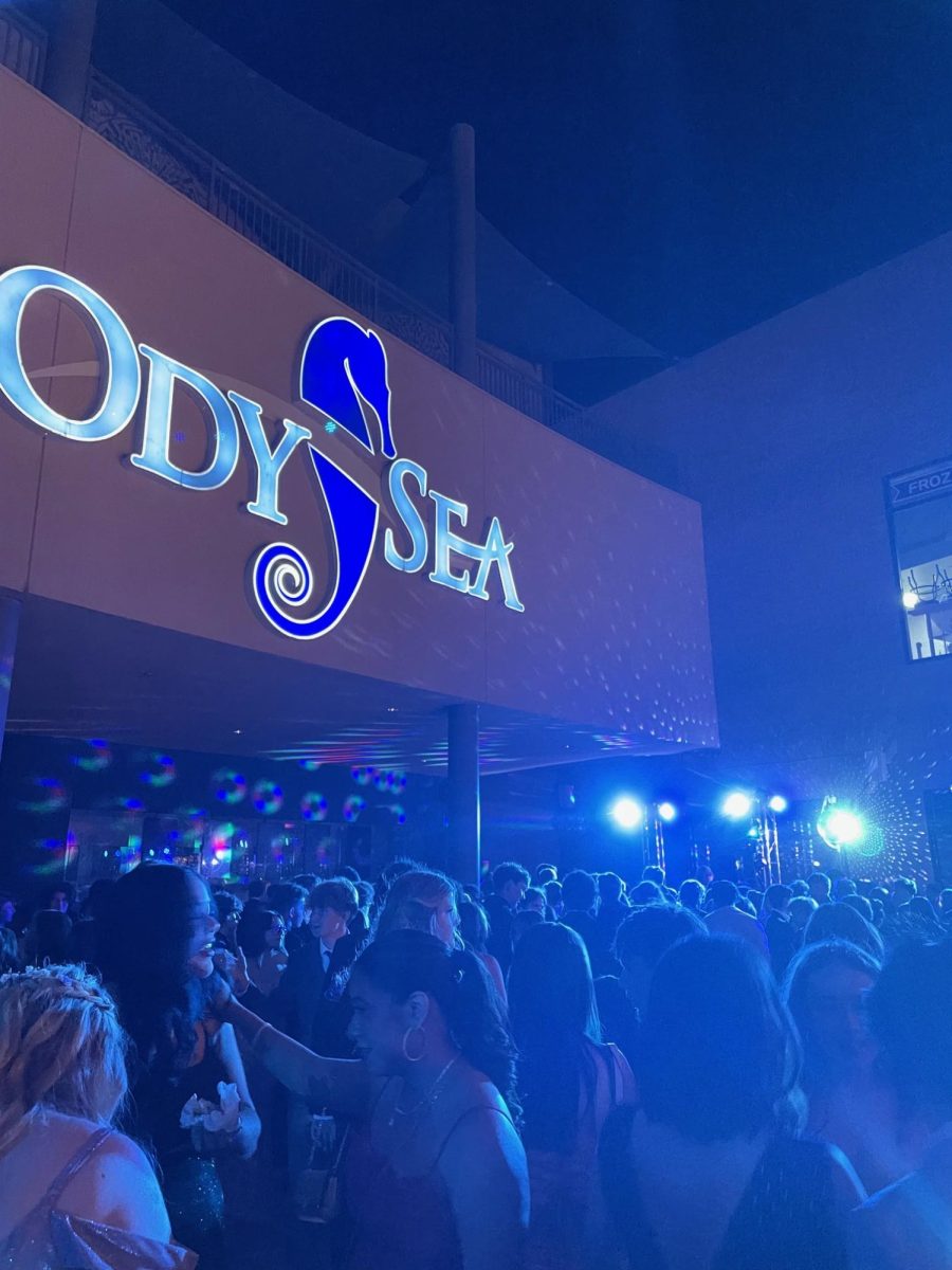 Dancefloor underneath Odysea Aquarium sign