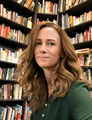 photo of Gordon in front of bookshelf