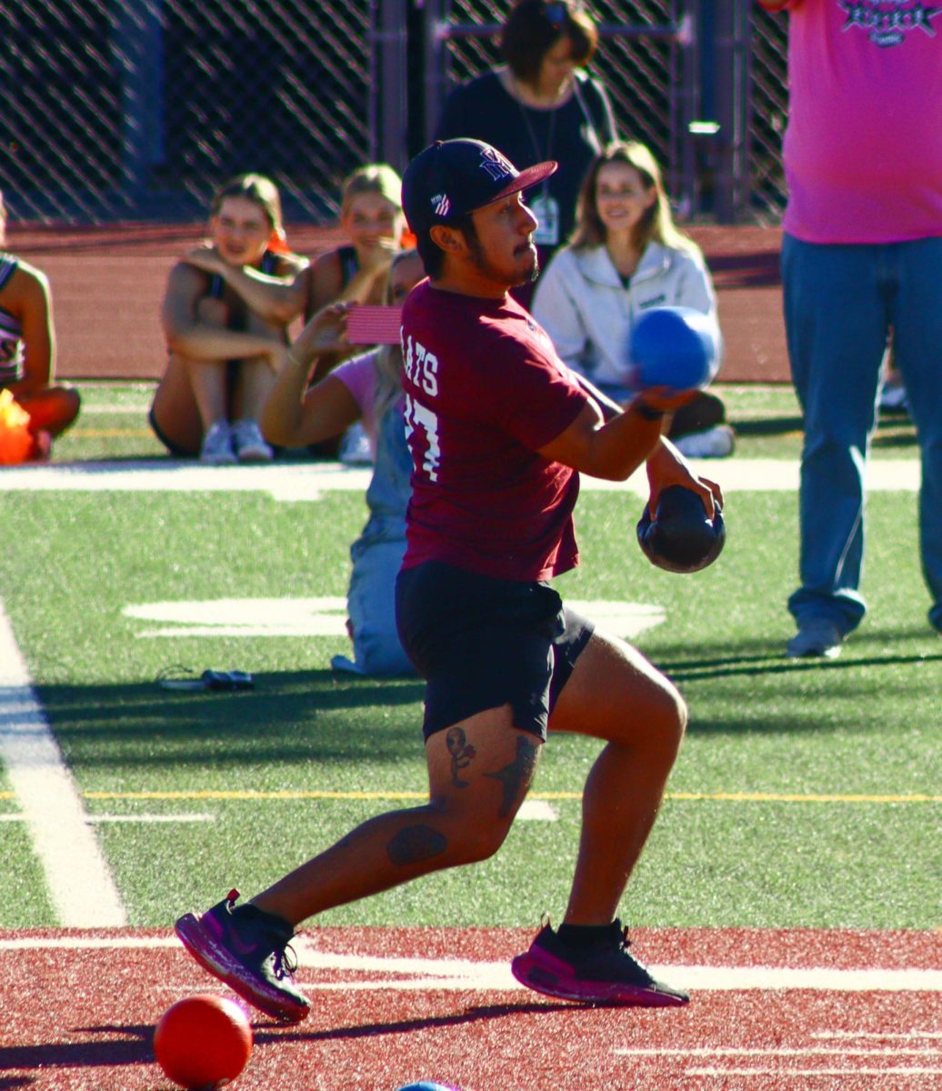 Teacher throws dodge ball