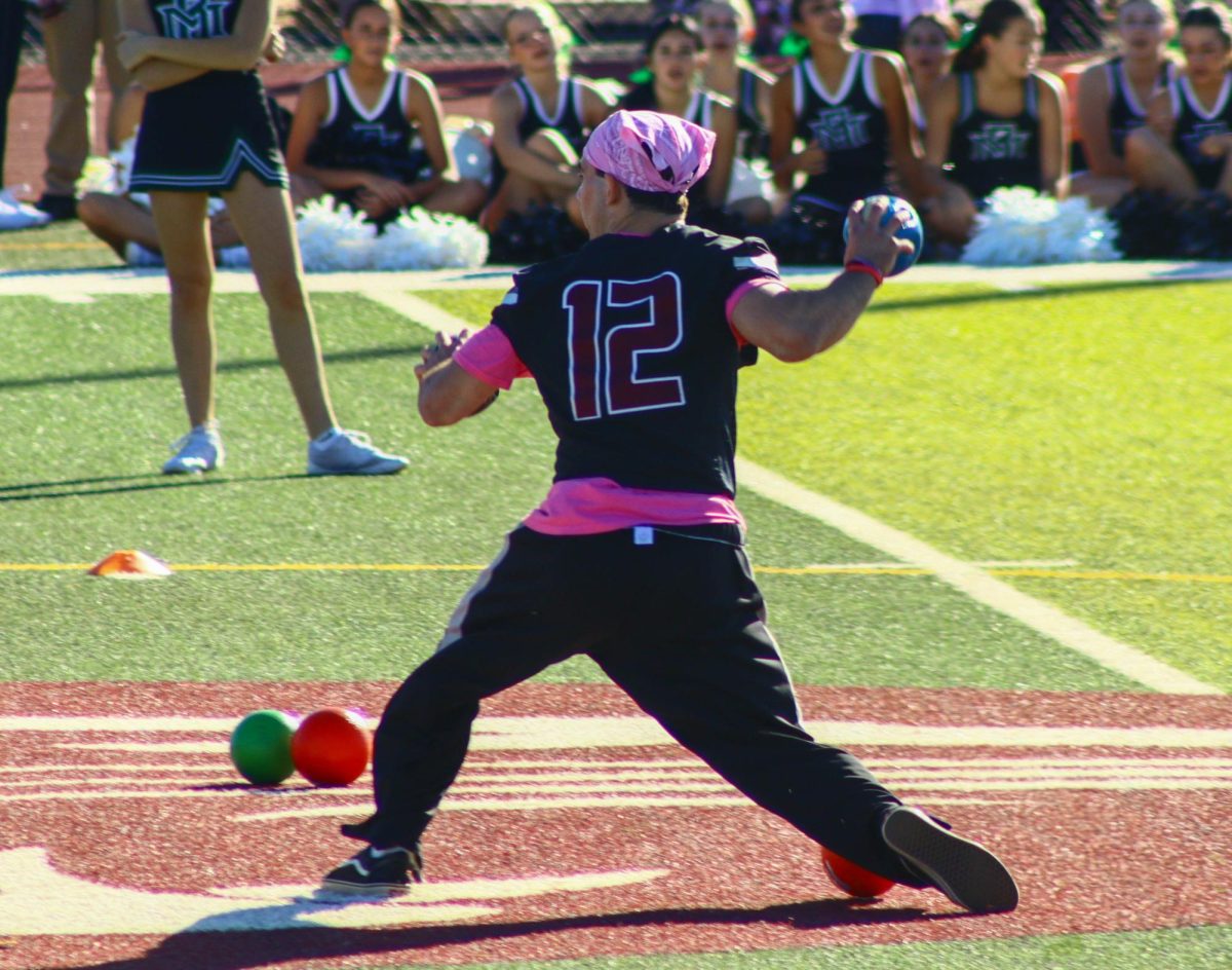 student throws dodgeball