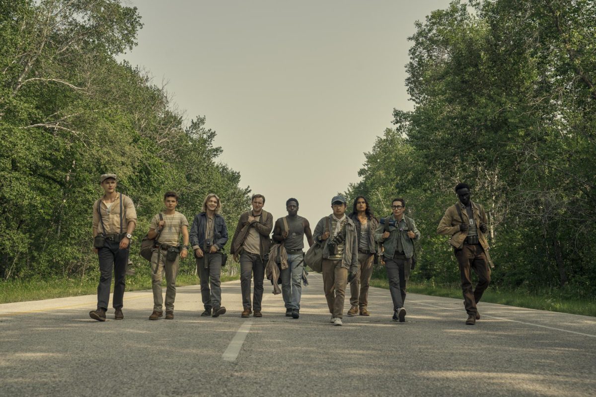 characters walk along a road