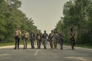 characters walk along a road