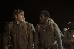 two characters talk to each other at night
