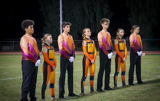Several members lined up on field