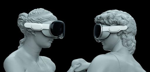 two statues wearing virtual reality glasses